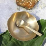 bronze serving bowl with spoon