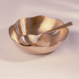 bronze serving bowl with spoon