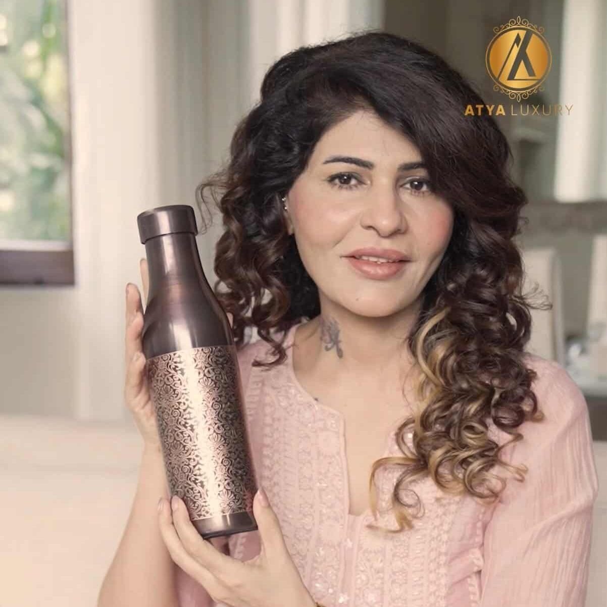 A girl holding Copper Water Bottle